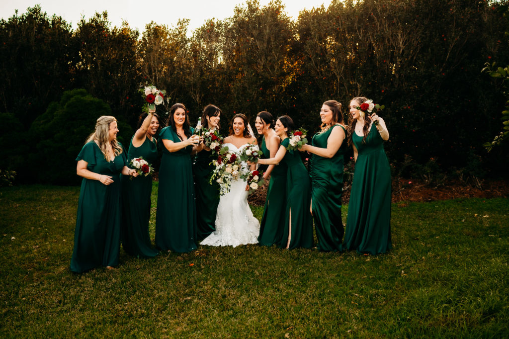 Wedding day champagne pop shot at Rip Van Winkle Gardens for a Louisiana Wedding
